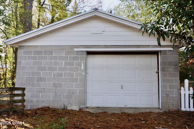 garage with fence