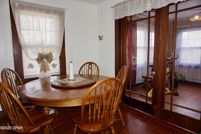 dining room with wood finished floors and french doors