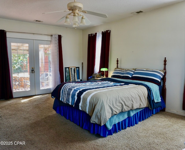 bedroom with visible vents, a ceiling fan, access to exterior, carpet flooring, and french doors