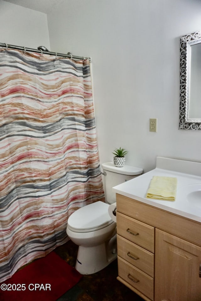 bathroom with vanity and toilet