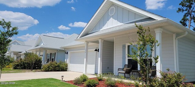 view of front of property featuring a garage and covered porch