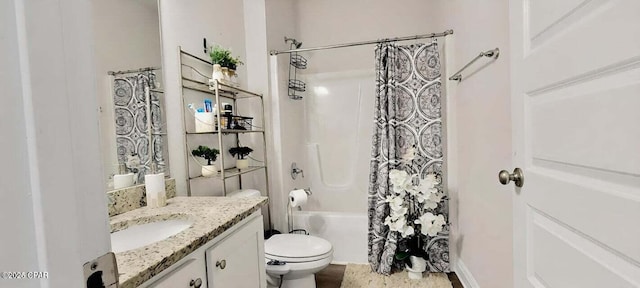 full bathroom with vanity, shower / tub combo, and toilet