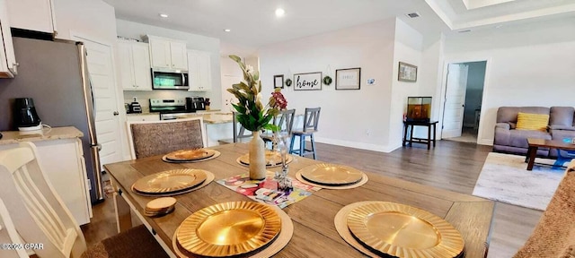 dining space featuring dark hardwood / wood-style floors