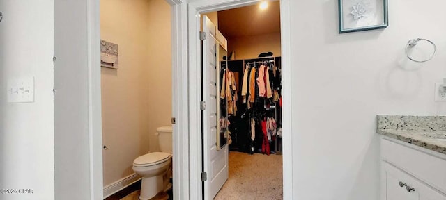 bathroom with vanity and toilet