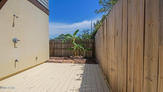 wooden deck featuring fence