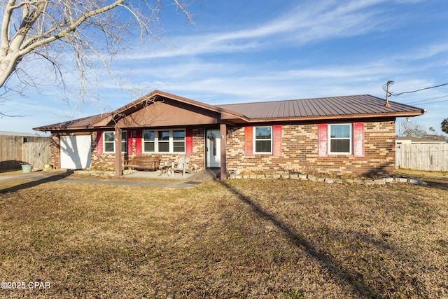 ranch-style house featuring a garage and a front yard