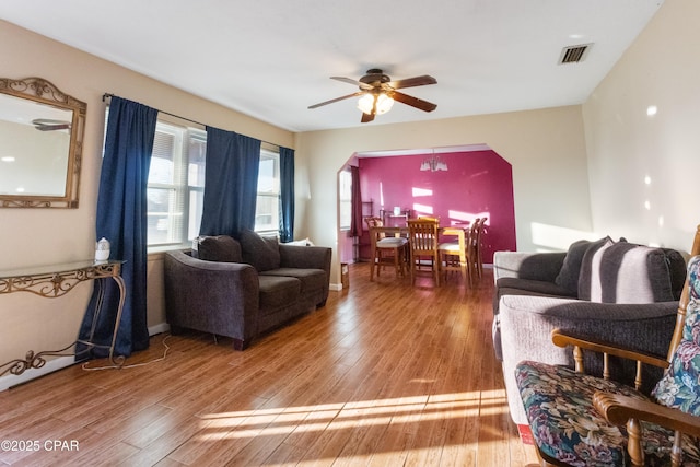 living room with hardwood / wood-style flooring and ceiling fan