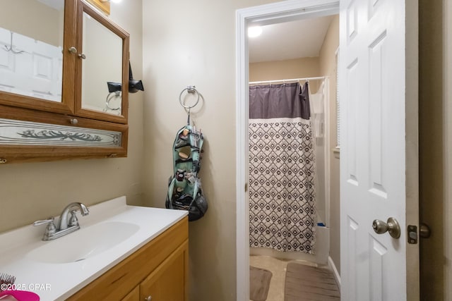 bathroom featuring vanity and shower / bath combo