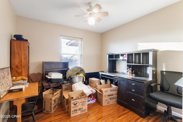 office area with ceiling fan and light wood-type flooring