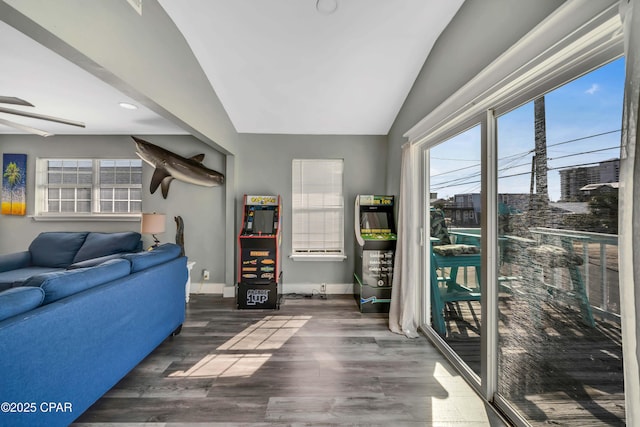 living room featuring lofted ceiling and dark hardwood / wood-style floors