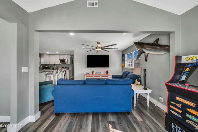 living room featuring dark hardwood / wood-style floors and ceiling fan