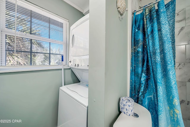 laundry area with stacked washing maching and dryer