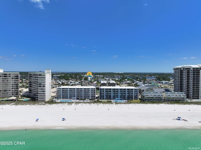 bird's eye view with a water view and a view of the beach