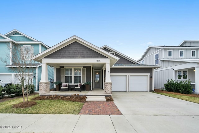 craftsman-style house with a garage and covered porch