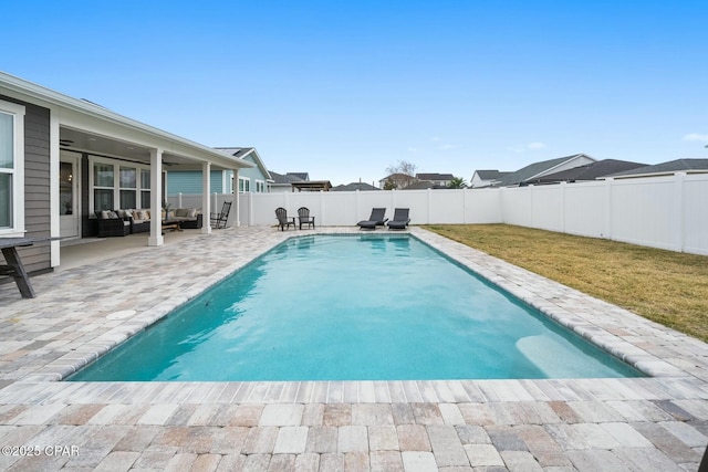 view of swimming pool featuring an outdoor living space and a patio