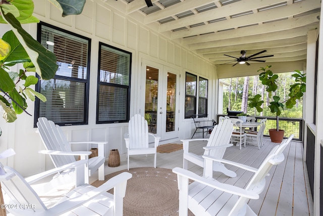 deck featuring outdoor dining space, french doors, and a ceiling fan