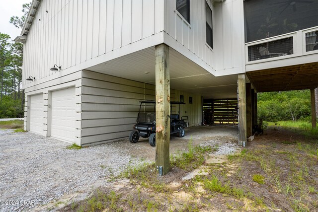 view of property exterior featuring a garage and a carport