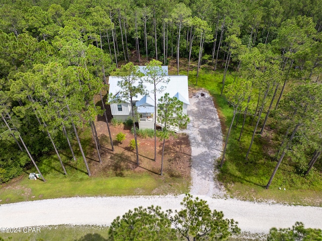 birds eye view of property featuring a wooded view