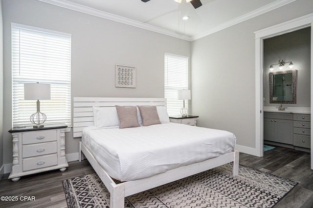 bedroom with ornamental molding, dark wood-type flooring, baseboards, and ensuite bathroom