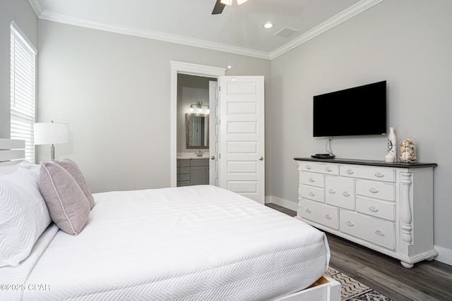 bedroom with dark wood-style floors, baseboards, visible vents, and crown molding