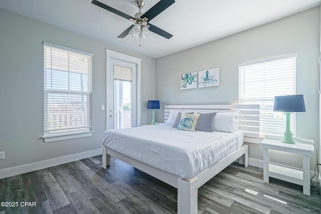 bedroom featuring a ceiling fan, baseboards, and wood finished floors