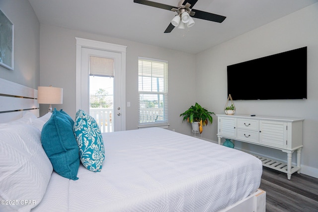 bedroom featuring a ceiling fan, access to outside, and dark wood finished floors