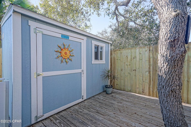 view of shed with fence