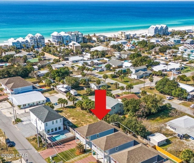 birds eye view of property featuring a water view and a residential view