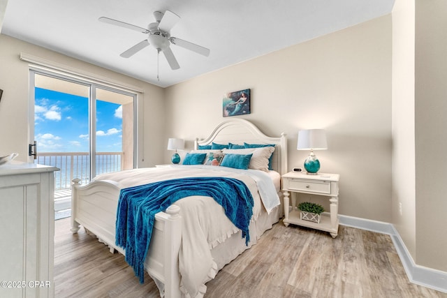 bedroom featuring a water view, ceiling fan, light wood-type flooring, and access to outside