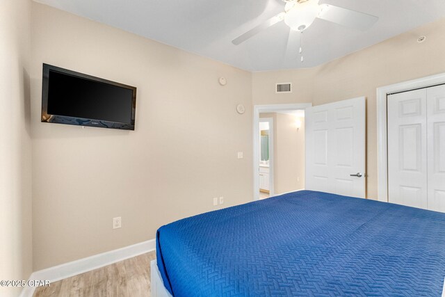 unfurnished bedroom with ceiling fan, wood-type flooring, and a closet