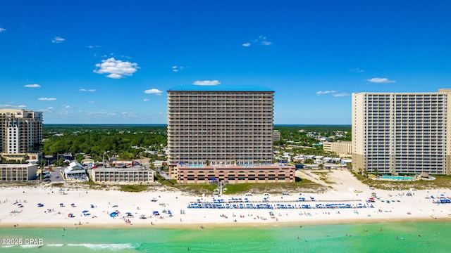 drone / aerial view with a water view and a beach view