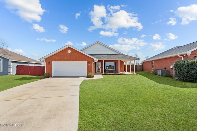 single story home featuring a garage, a front yard, central air condition unit, and covered porch