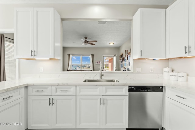 kitchen featuring white cabinetry, dishwasher, sink, light stone counters, and ceiling fan