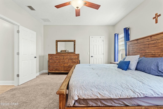 bedroom featuring light carpet and ceiling fan