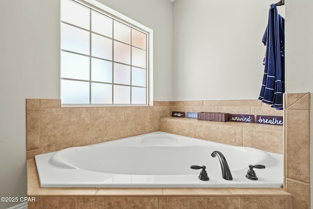 bathroom with tiled tub