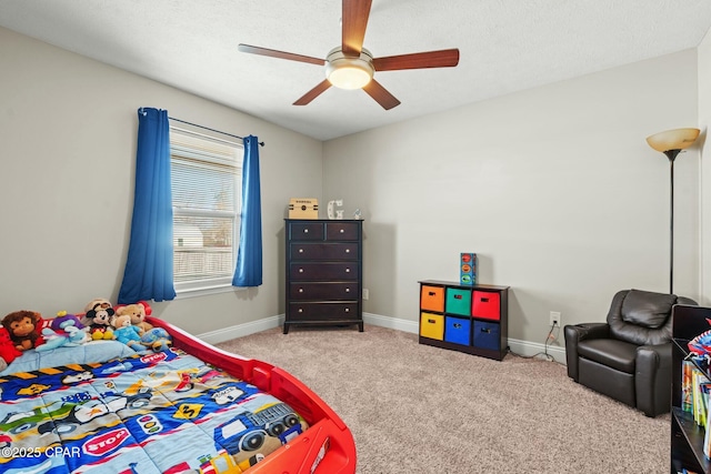 bedroom with light carpet, a textured ceiling, and ceiling fan