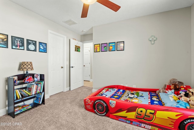 carpeted bedroom with ceiling fan