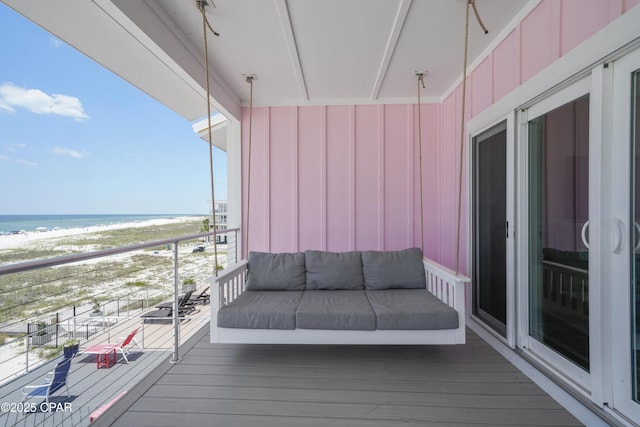 balcony with a view of the beach and a water view