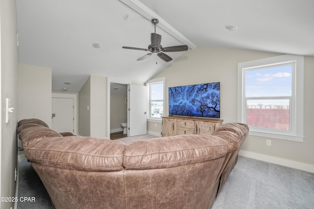 carpeted living room with lofted ceiling with beams and ceiling fan