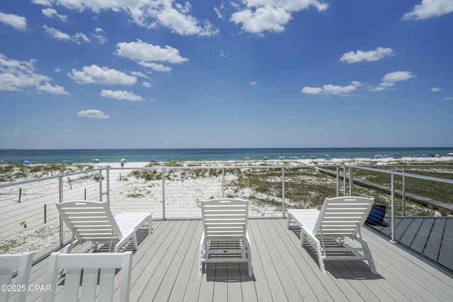 wooden terrace with a water view and a beach view