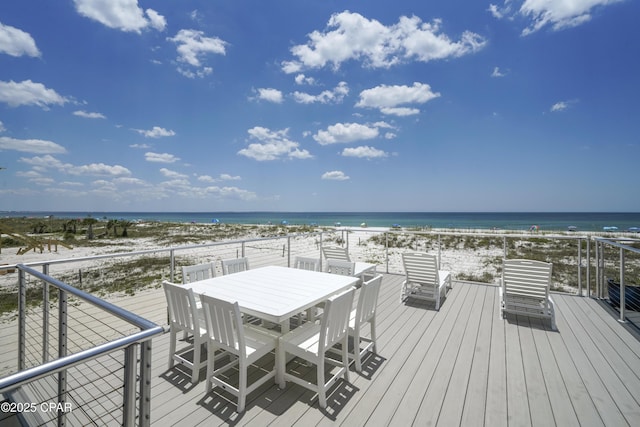 wooden terrace with a beach view and a water view