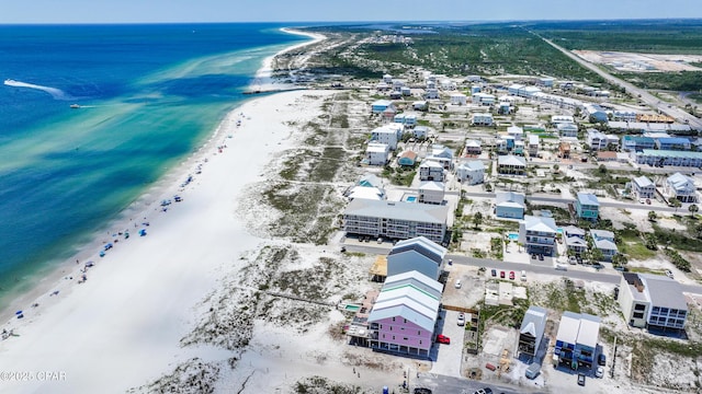 bird's eye view featuring a view of the beach and a water view