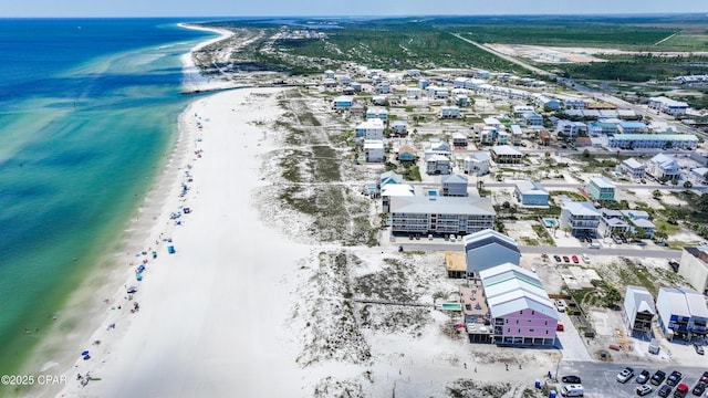 aerial view with a water view and a view of the beach