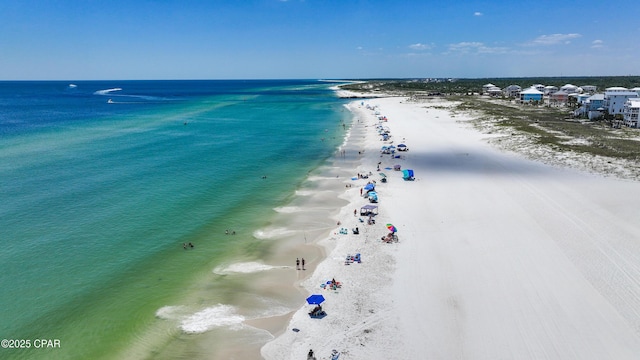 aerial view featuring a water view and a beach view