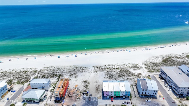 aerial view featuring a water view and a beach view