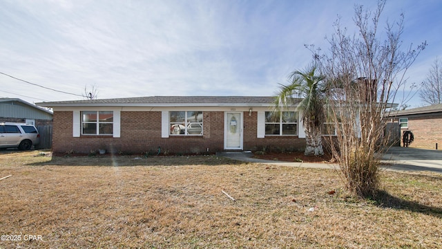 ranch-style home with a front yard