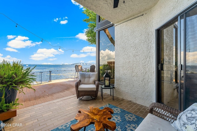 balcony featuring a water view