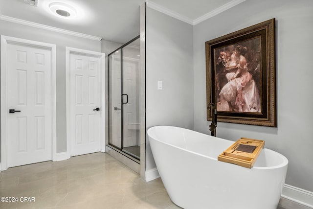 bathroom featuring ornamental molding and shower with separate bathtub