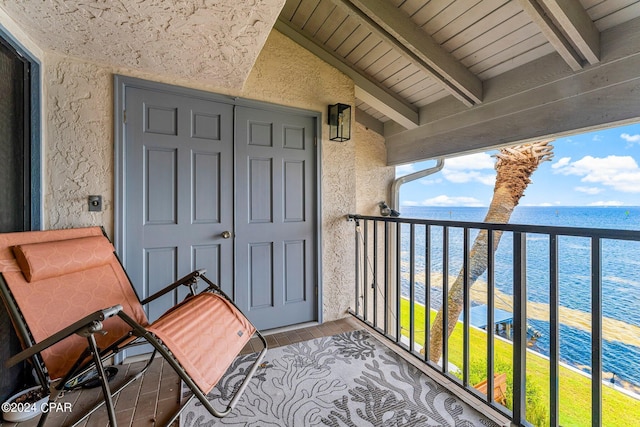 balcony featuring a water view