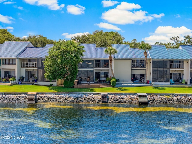 rear view of house with a water view